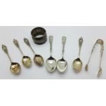 Six silver spoons, (4+2), a pair of silver sugar bows and a silver napkin ring, (napkin ring a/f),