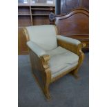 An Art Deco Beidermeier birds eye maple armchair