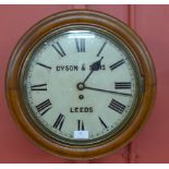 A beech circular fusee wall clock, the dial signed Dyson & Sons,