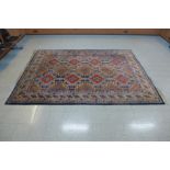 A large blue ground geometric pattern rug,