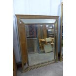 A Victorian gilt framed cushion shaped mirror,