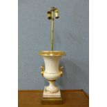 A French style white porcelain and gilt campana shaped table lamp