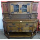 An Arts and Crafts oak buffet sideboard