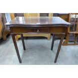 An Edward VII Waring & Gillows mahogany fold-over tea table