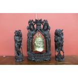 A 19th Century Chinese bell on carved hardwood stand and matching pair of figures