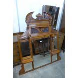 An Edward VII carved walnut overmantel mirror