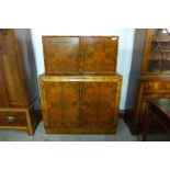 An Art Deco burr walnut cocktail cabinet