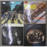 Three The Beatles LP records, Abbey Road, Please Please Me,