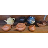 Seven terracotta oriental teapots,