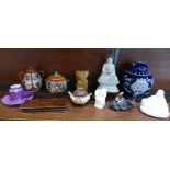 A collection of oriental ceramics including a 19th Century Buddha, ginger jar, etc.