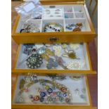 A jewellery box and contents including a pair of 9ct gold earrings and brooches, etc.