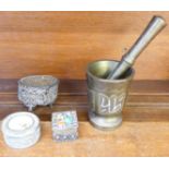 A bronze pestle and mortar and three trinket pots