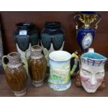 A Sarreguemines France character jug, a pair of Eichwald vases, a pair of Doulton style vases,