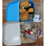 Two Steiff Teddy bears in suitcases