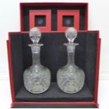 A pair of cut glass crystal decanters, one a/f (small chip to rim),