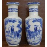 A pair of Chinese blue and white vases, decorated with elders riding tigers,