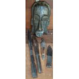 A carved African mask and four other carved items