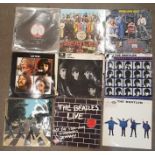 Eight The Beatles LP records and one The Who LP record,