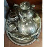 A four piece silver plated tea service and three trays