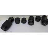 Four camera lenses including Hanimex 135mm,
