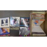 A box of approximately 100 1980's 7" vinyl singles
