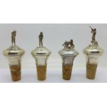 Four silver mounted bottle stops, golf, cricket,