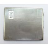 A silver cigarette case,