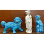 Two blue oriental temple dogs and a figure of a Geisha