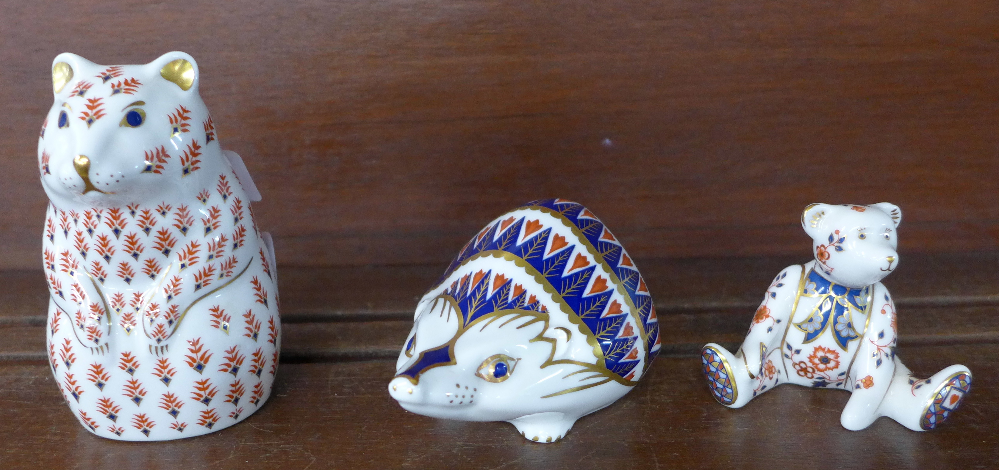 Three Royal Crown Derby paperweights, hamster with silver stopper,