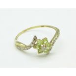 A 9ct gold, peridot and diamond ring, 1g,