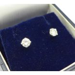 A pair of 18ct white gold and diamond stud earrings, total diamond weight 0.