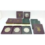 Seven 1951 Festival of Britain crowns (six boxed with papers and one boxed without papers)