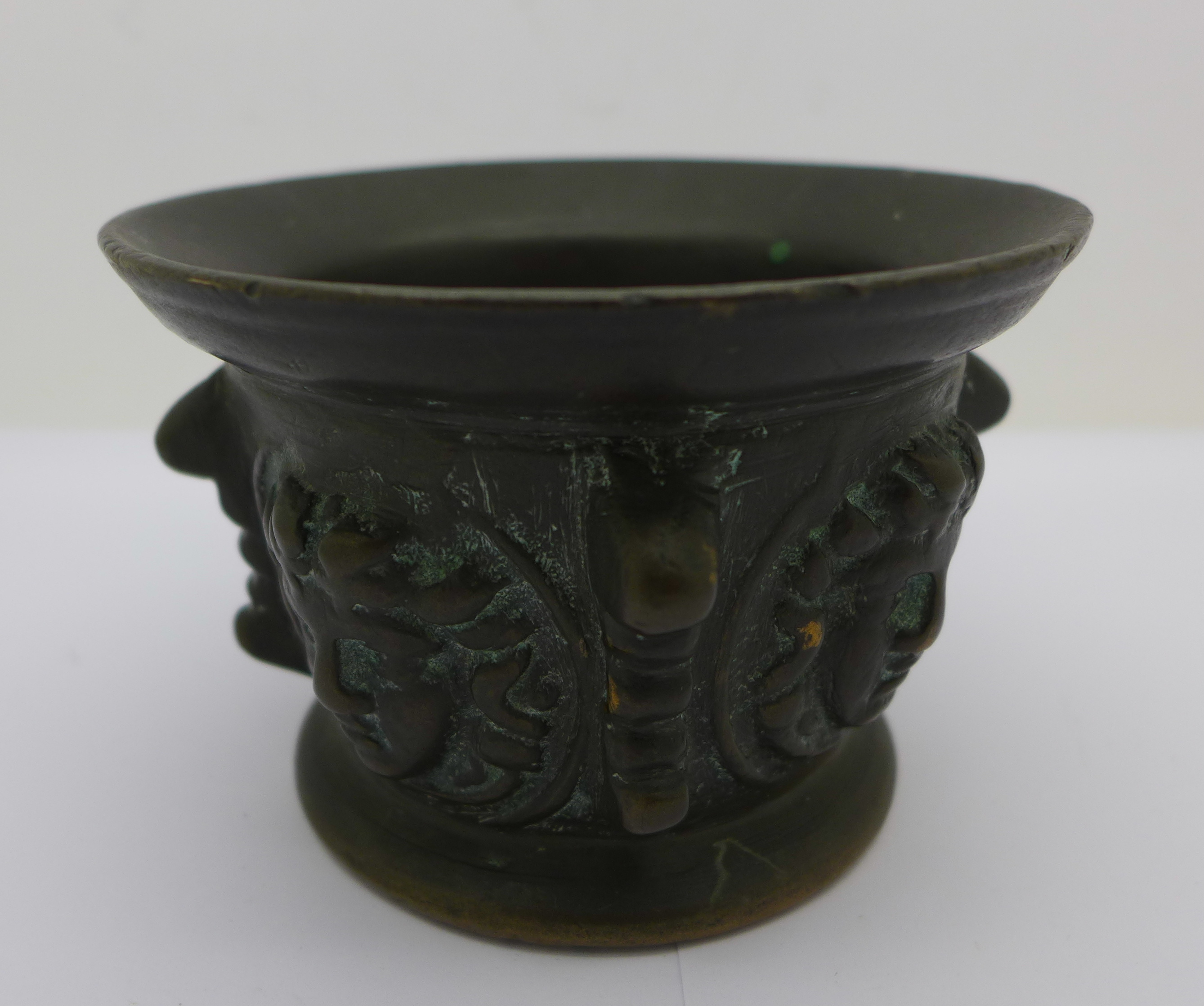 An Italian 18th Century bronze mortar with Medusa masks