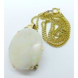 A 9ct gold set opal pendant and chain with brooch pin, 25mm x 21mm,