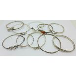 Ten bangles including eight silver,