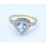 A 9ct gold, blue stone and diamond ring, 1.