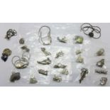 Twenty-five silver pendants and chains