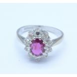 An 18ct gold, ruby and diamond cluster ring, Birmingham 1976, diamond weight 0.50ct, ruby content 0.