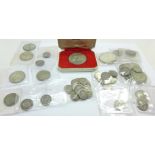 A collection of seventy-three silver and half silver coins