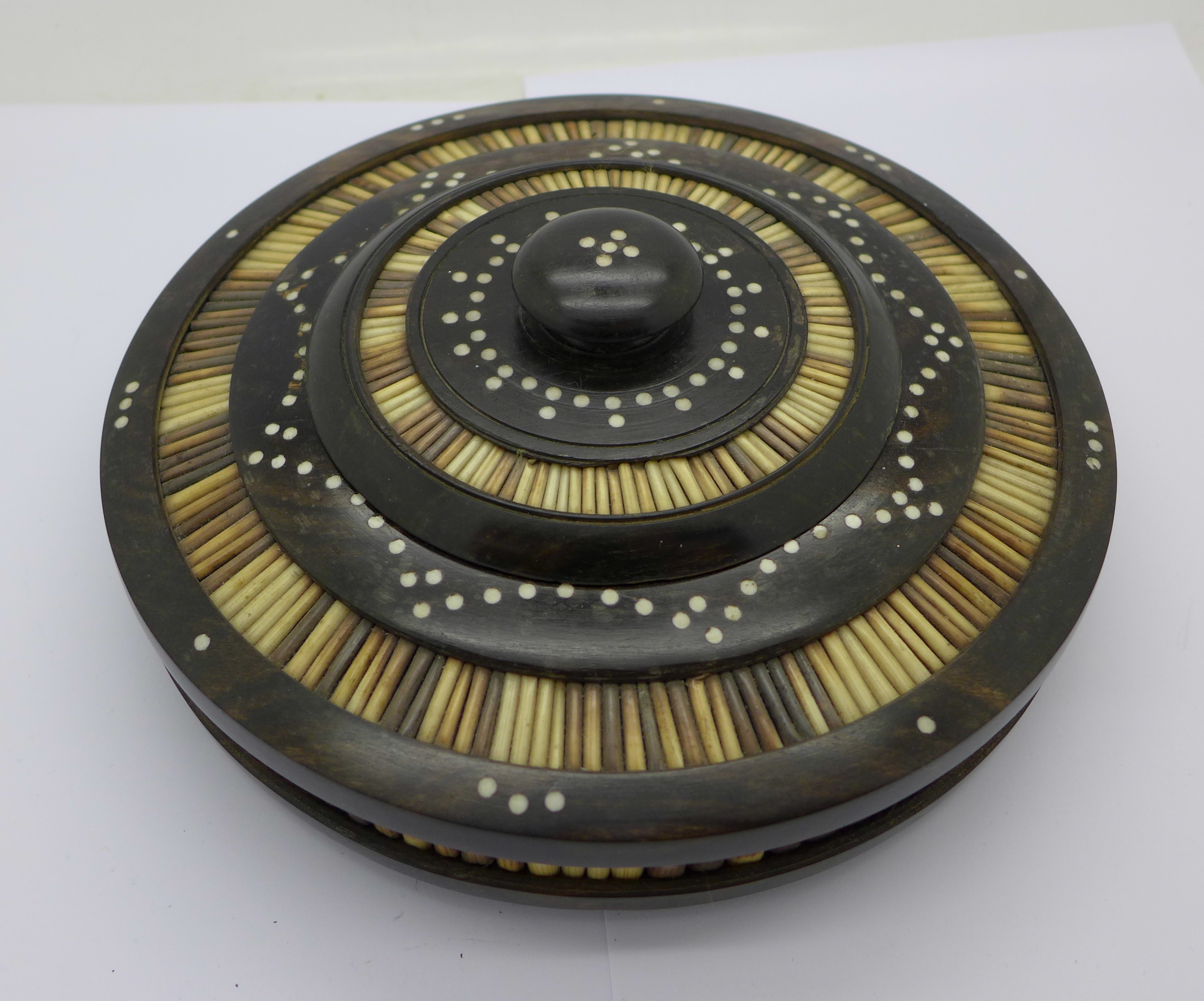 A circular Anglo-Indian porcupine quill and hardwood bowl with lid, inlaid with bone decoration,