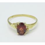 A 9ct gold, garnet and diamond ring, 1.