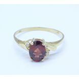 A 9ct gold, garnet and diamond ring, 1.