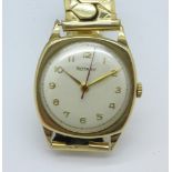 A 9ct gold cased Rotary wristwatch on a 9ct gold metal core expanding bracelet strap,