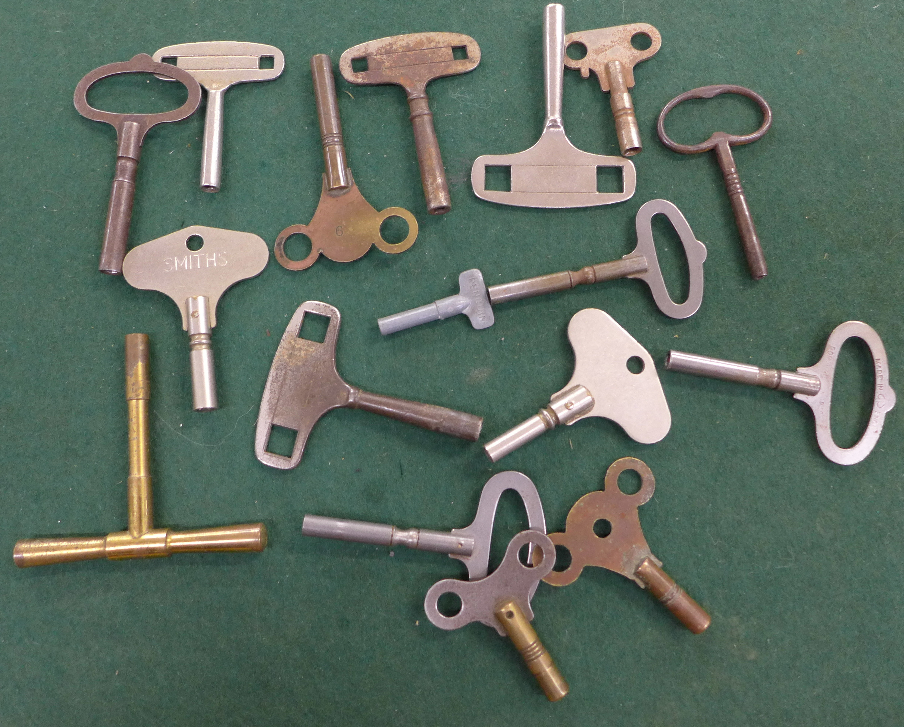 A collection of seventeen clock keys,