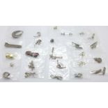 Twenty-five pairs of silver earrings