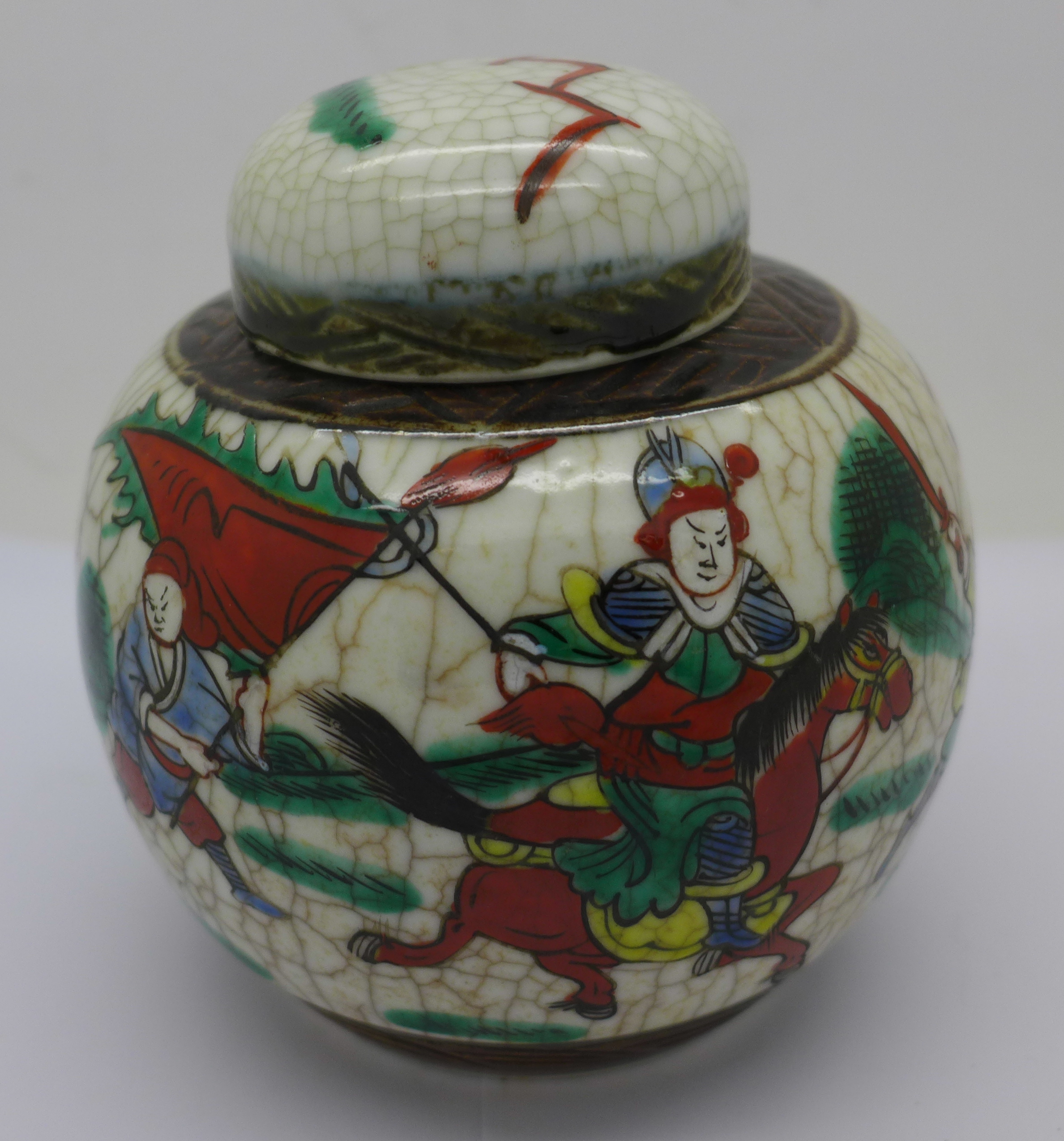 A Chinese ginger jar decorated with fighting scene, 11.