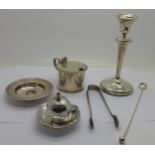 A silver candlestick, silver dish, silver inkwell top, lacking glass,