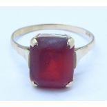 A 9ct gold and red stone ring, 1.