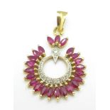 An 18ct gold, ruby and diamond pendant, 4.