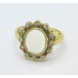 An 18ct gold, moonstone and diamond ring, 4.